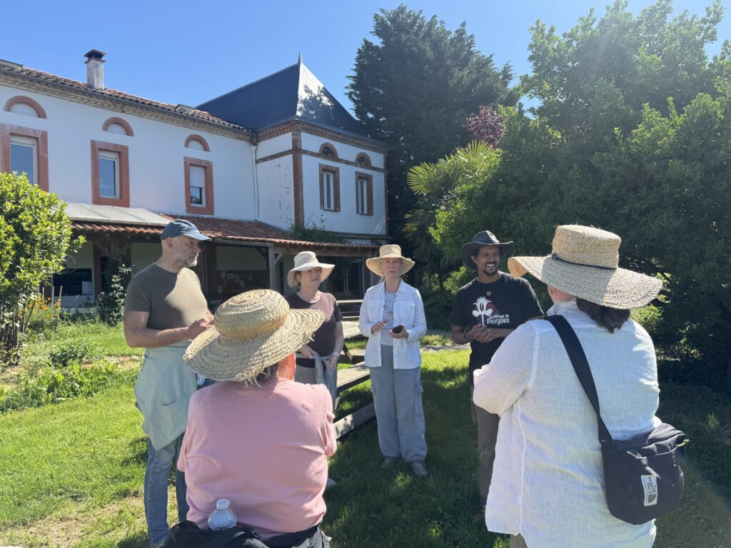 Learning about conflict in intentional communities on the France Ecovillage Tour.